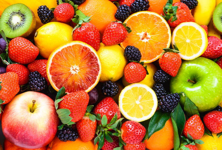 Variety of summer fruits including citrus and berries